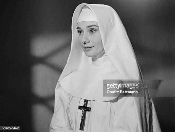 Costumed for her new movie role, Audrey Hepburn poses in a nun's habit in Rome. The actress will star in The Nun's Story to be filmed in Italy and...
