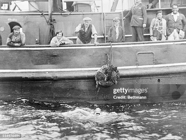 This is one of the first photos to arrive in America from Europe via Quebec, and airplane to New York, showing Gertrude Ederle in her successful...