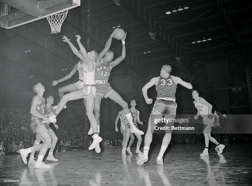 Wilt Chamberlain Leaping over Others