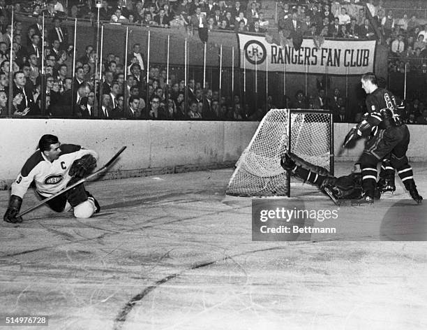 Veteran Maurice Richard , of the Montreal Canadiens, goes down on the ice after scoring his 600th goal past Lou Fontinato and fallen goalie Lorne...