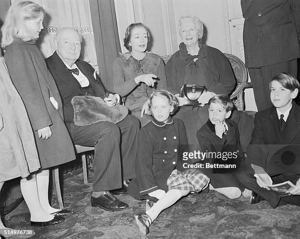 Britain's Sir Winston and lady Churchill are shown with members of thier family at the Scala Theatre, where they saw their daughter, actress Sarah...