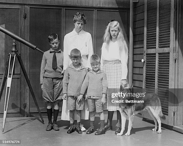 Left to right here are Elliot, Mrs. Roosevelt, Franklin Jr., John and Anna with their dog "Chief." They are at the summer home at Campello, where...