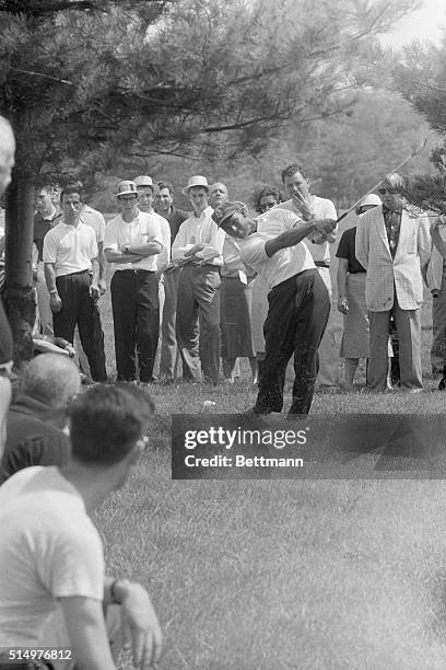 Golfer Arnold Palmer, of Latobe, Pennsylvania, works hard to send the ball out here, before he scored an eagle two on the 3rd hole during the 3rd...