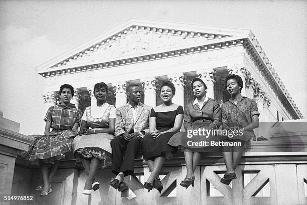 Six black children who attended Little Rock's Central High School earlier in 1958, sit outside the Supreme Court in this 8/22/58 photo. The NAACP...
