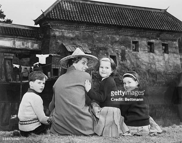 Actress Ingrid Bergman enjoys a recent afternoon with her three children : twins Isabella and Ingrid [Isotta], 6; and Roberto, 8.