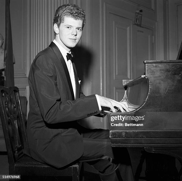 New York, New York- Famed American pianist, Van Cliburn, sits at the keyboard during a dinner in his honor at the Lotos Club .