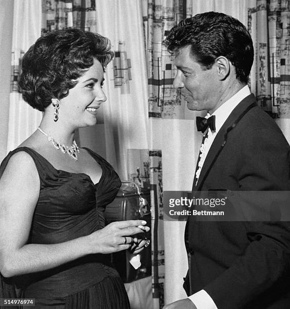 Las Vegas, NV- In her first public appearance since the death of Mike Todd, Elizabeth Taylor congratulates Eddie Fisher backstage at the Tropicana...