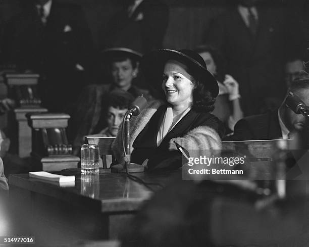 Virginia Hill, girlfriend of Las Vegas mobster Ben "Bugsy' Siegel, laughs as she testifies before the Kefauver organized crime hearings in New York.