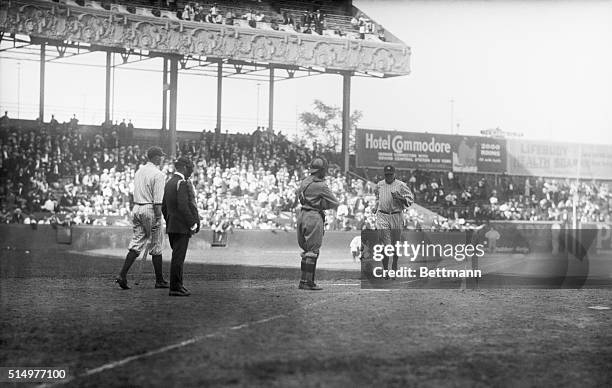 This remarkable photo taken at the Polo Grounds today shows Babe Ruth starting out on what proved to be his twenty-first home run of the season. The...