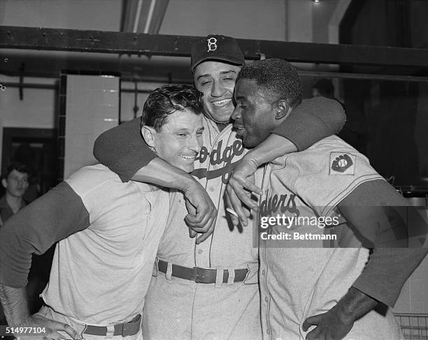 Left to right in this photograph are Andy Pafko who hit a two run homer and Jackie Robinson who did a great job both at hitting and fielding in this...