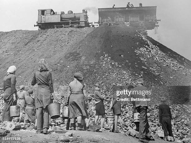 Bucket Brigade Lines Up for Coal "Drippings" -- Frankfurt, Germany.....Not because they anticipate a coal shortage in the Ruhr area this winter, but...