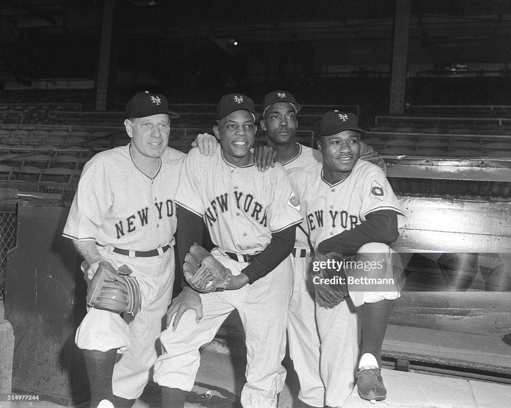 Baseball Greats Holding Baseball Gloves