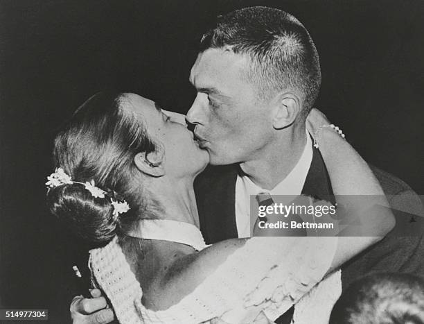 Detroit: Tiger pitcher Jim Bunning is greeted by wife, Mary, at Willow Run airport late 7/20 after flight from Boston where he pitched a no-hitter...