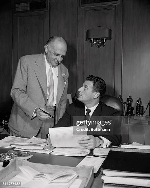 Motion picture production deal involving $25 000 and thirty feature films has been signed between Columbia Pictures Corporation and the Stanley...