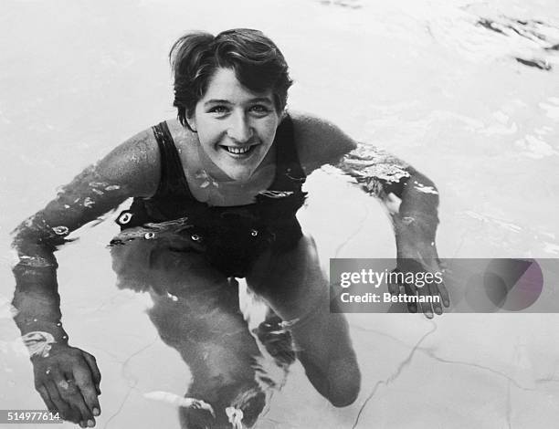 Taking it easy after a practice swim here in preparation for the Empire games which open on July 16th, is Australian champion swimmer Dawn Fraser,...