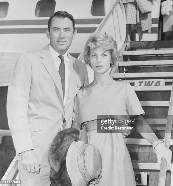 Gregory Peck and his wife are shown on arrival at Idlewild Airport, after a TWA flight from Los Angeles. Peck will make a personal appearance tour in...