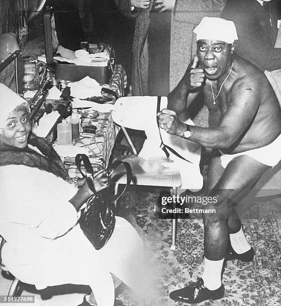 Umea, Sweden: Despite "threatening" gesture, jazz great Louis Armstrong seems to take it in good fun when he finds a lensman snapping him in rather...
