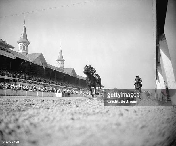 Hill Gail, in the great tradition of the Calumet Farm, crosses the finish line for a thrilling victory in the 78th running of the Kentucky Derby,...