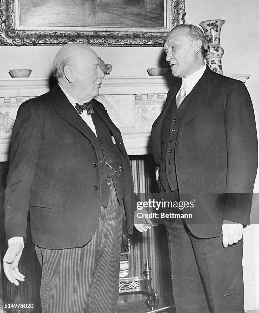 German Chancellor Confers with Churchill. London: Britain's Prime Minister Winston Churchill and German Chancellor Konrad Adenauer are shown as they...