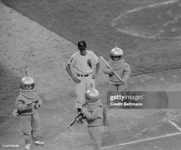 Chicago: Luis Aparicio, White Sox shortstop is surrounded by "Spacemen" who arrived by helicopter in Comiskey Park before game 5/26 against the...