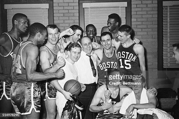 The Boston Celtics "whoop it up' in the dressing room after they beat the Minneapolis Lakers, 118-113, to win the NBA title here 4/9. The Celtics won...