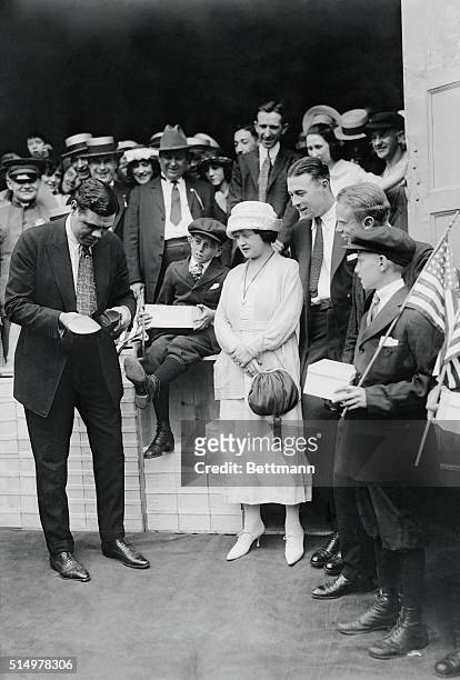 New York City: Babe Ruth Gives "Home Run" Shoes Away. Babe Ruth the Yankees Home Run King, giving away thirty two pairs of shoes to youngsters of the...