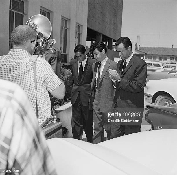 Las Vegas, Nevada: Eddie Fisher , is accompanied by Mike Todd Jr. , and UPI reporter Vernon Scott as the singer arrives at the County court to obtain...