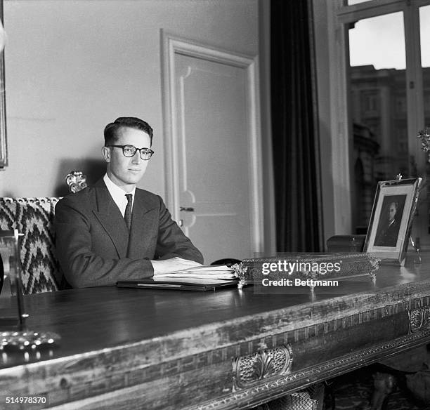 King Baudouin of Belgium, shown at his desk in the Royal Palace here on April 28th, was planning to pay a state visit to the U.S. On May 11th, 1959....