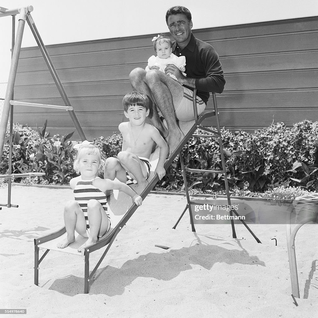Peter Lawford with Children on Slide