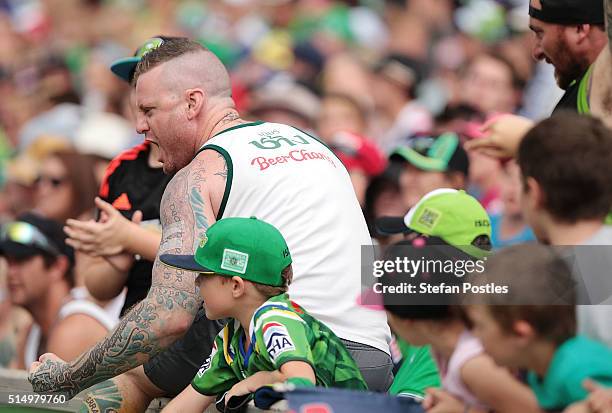 Raiders fans celebrate during the round two NRL match between the Canberra Raiders and the Sydney Roosters at GIO Stadium on March 12, 2016 in...