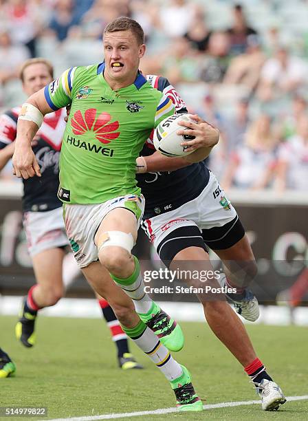 Jack Wighton of the Raiders is tackled during the round two NRL match between the Canberra Raiders and the Sydney Roosters at GIO Stadium on March...