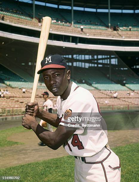 Hank Aaron in a batting pose, wearing a Milwaukee Braves uniform.