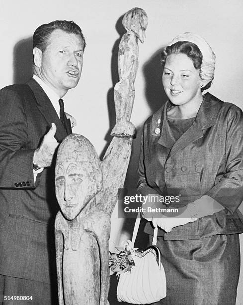 Princess at Art Exhibit. Manhattan, New York, New York: New York Governor Nelson Rockefeller points out a statue to visiting Princess Beatrix of the...