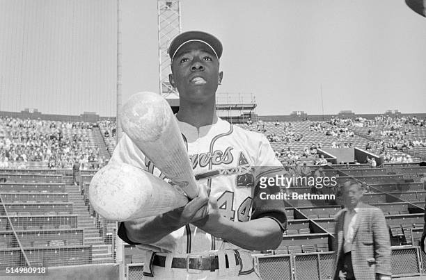 Milwaukee Braves outfielder Hank Aaron doesn't really pack monstrous bats like these. It simply looks that way to the opposition, as Aaron sports his...