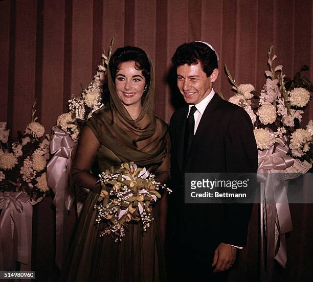 Las Vegas, NV- Eddie Fisher and Elizabeth Taylor are shown after their wedding at Temple Beth Shalom. No pictures were allowed during the actual...