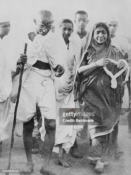 Mahatma Gandhi, leader of the Indian civil disobedience revolt as he marched to the shore at Dandi, to collect salt in violation of the law. On the...