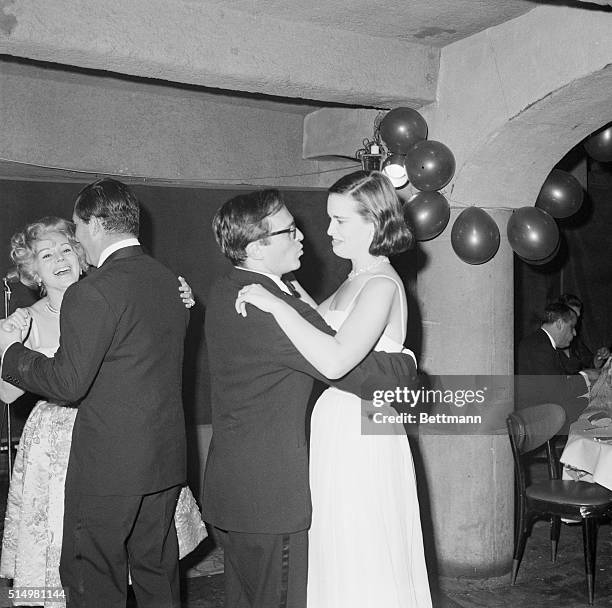 Star Gathering. Eva Gabor and her new husband Richard Brown share the dance floor with Director Sidney Lumet and his wife Gloria Vanderbilt. Fisher's...