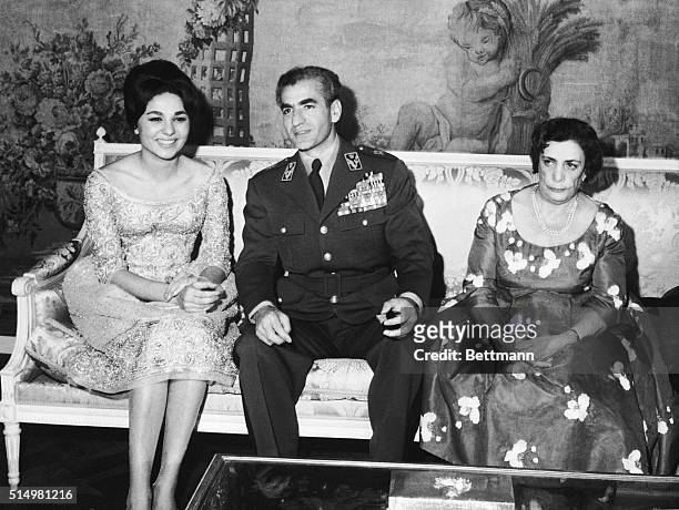 November 26 Shah, Fiance, and Queen Mother in Tehran, Iran: Seated at a divan in the royal palace. : Farah Diba: the Shah of Iran, and the Queen...