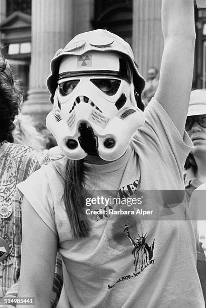 An anti-nuclear protestor wearing a Stormtrooper helmet from the movie 'Star Wars' at a People's Convention on Eighth Avenue, New York City, during...