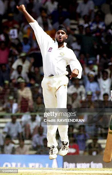 Indian spinner Harbhajan Singh celebrates after dismissing Australian batsman Gillespie during the fifth day of the third cricket test between India...