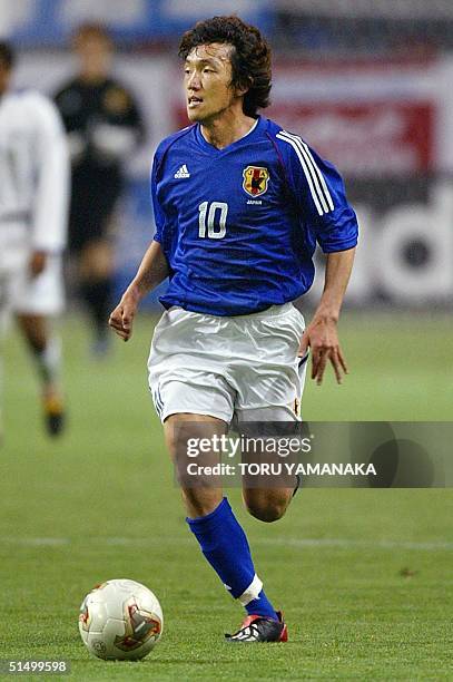 Japanese midfielder Shunsuke Nakamura dribbles the ball during Kirin Cup football tournament between Japan and Honduras, 02 May 2002 in Kobe, western...