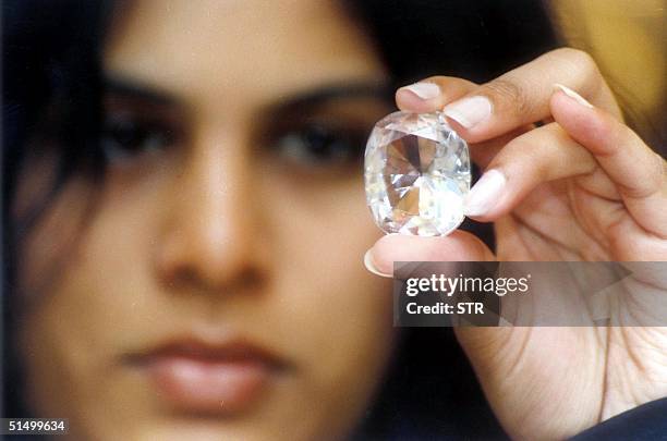 Executive Director of Jewels de Paragon Pavana Kishore shows the "Koh-I-Noor" diamond on display with other famous diamonds at an exhibition intitled...