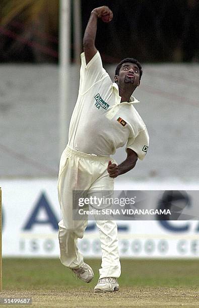 Sri Lankan spin bowler Muttiah Muralitharan throws a ball during the first day of the first Test match between Sri Lanka and Bangladesh at the P.Sara...