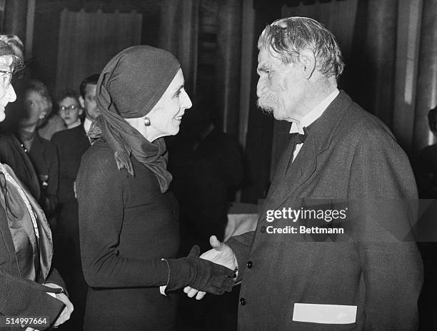 Dr. Albert Schweitzer, winner of the Nobel Prize last year is shown as he greeted Karen Blixen, famous Danish author, in Copenhagen on his stop-off...