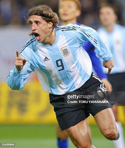 Argentine forward Hernan Crespo reacts with joy when he scores a goal during the second half of their friendly match at Saitama Stadium in Saitama,...