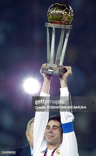 Spanish club team Real Madrid captain Fernando Ruiz Hierro raises the Inter-Continental Cup trophy after winning over South American champion Olimpia...