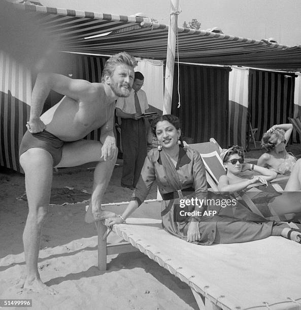 Film actor Kirk Douglas and the Indian actress Mehtab rest at the Lido beach, 01 September 1953, during the Venice Film Festival. Douglas born in...