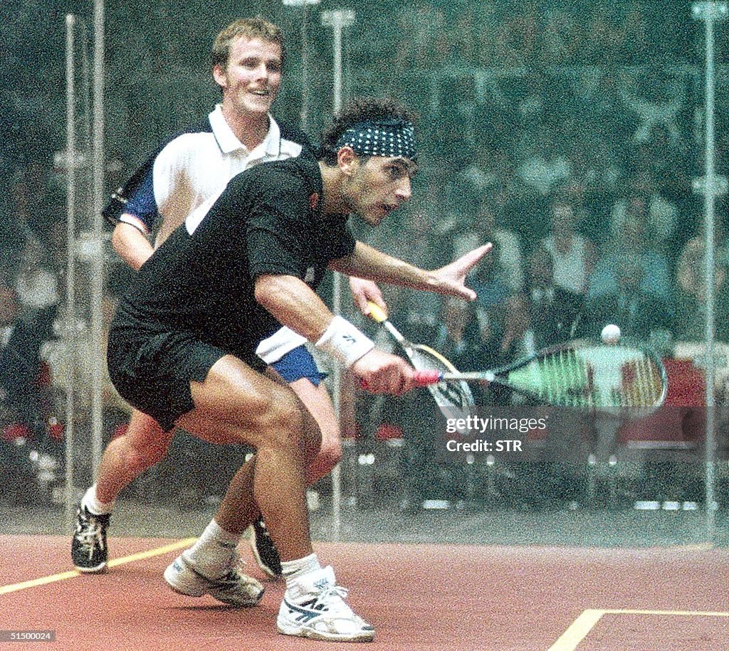 Scotland's Peter Nicol (back) beats Egyptian Ahmad