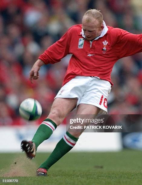 Welsh fly-half Neil Jenkins takes a penalty kick during the Rugby World Cup first round match between Wales and Samoa14 October 1999 at Cardiff...