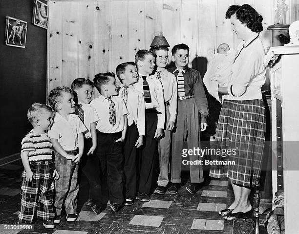 Mrs. Dorothy Langohr introduces her newest son, three day old Douglas to his brothers, all eight of them, in their Detroit home. The lineup : Dean,...